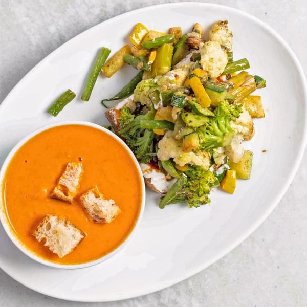 White Maple Café's tomato soup with croutons and a side of roasted vegetables.